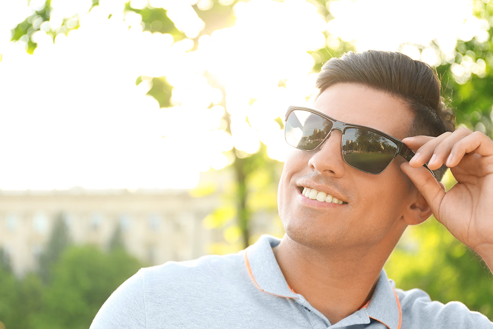 man looking cool while staying safe from the sun